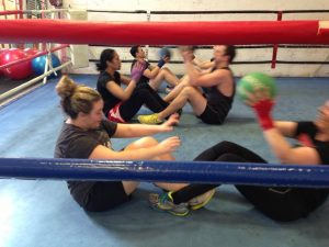 Boxing fitness class abdominal work.